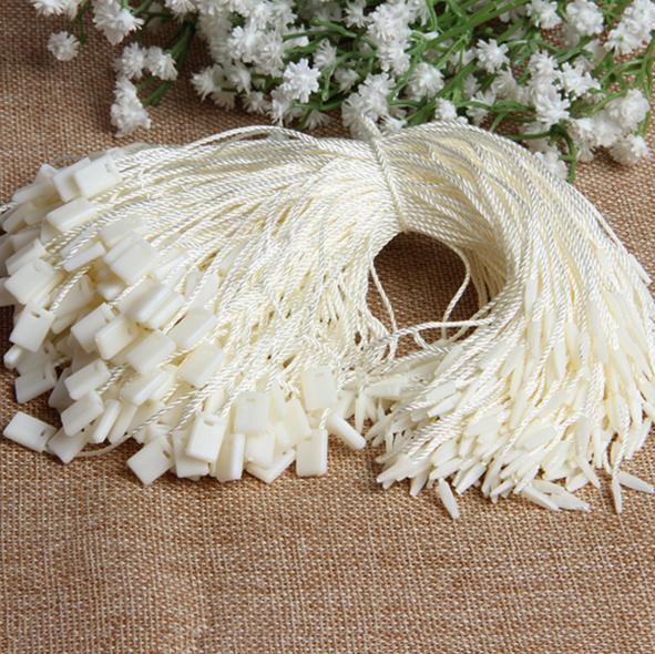 アイボリープラスチックシールタグ、一般的に使用ナイロン文字列衣服ハングタグファスナー-アパレル副資材　タグ問屋・仕入れ・卸・卸売り